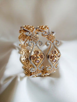 B0161_Gorgeous crafted bangles with floral design studded with American Diamond stones.