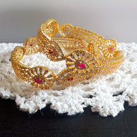 B0230_Lovely traditional Vintage Style Gold Plated studded with american diamond stones with a touch of pink rubies.