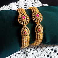 B0230_Lovely traditional Vintage Style Gold Plated studded with american diamond stones with a touch of pink rubies.