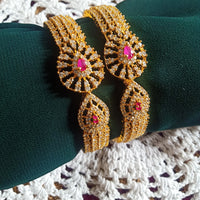 B0230_Lovely traditional Vintage Style Gold Plated studded with american diamond stones with a touch of pink rubies.