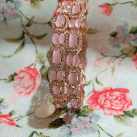 B0231_Elegant Rose Gold bangles embellished with American Diamond stones with a touch of dazzling pink stones.