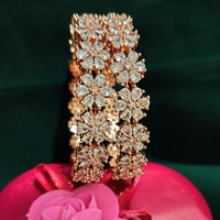 B0155_S_Elegant Rose gold bangle with flower design studded with American Diamond stones.