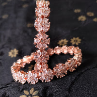 B0155_S_Elegant Rose gold bangle with flower design studded with American Diamond stones.