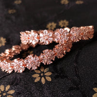 B0155_S_Elegant Rose gold bangle with flower design studded with American Diamond stones.