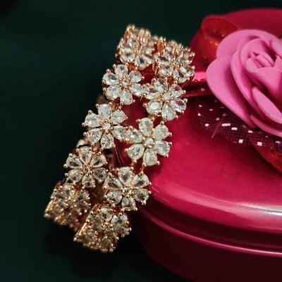 B0155_S_Elegant Rose gold bangle with flower design studded with American Diamond stones.