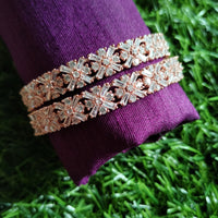 B0240_Lovely Rose gold bangle with delicate design embellished with American Diamond stones.