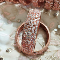 B0239_S_Ravishing Broad Rose gold bangle with delicate flower design embellished with American Diamond stones.