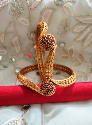 B069_Gorgeous Gold plated bangles studded with pink ruby stones.