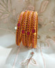 B0242_Classic style gorgeous Gold plated bangles studded with pink ruby stones.