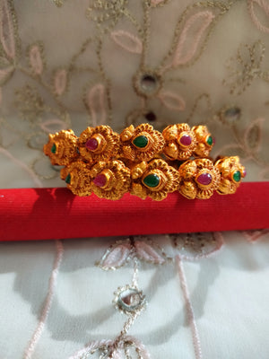 B0241_Traditional style gorgeous Gold plated bangles studded with pink & green ruby stones.