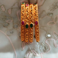 B0239_Gorgeous Gold plated bangles studded with pink & green ruby stones.