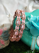 B0231_Elegant Rose Gold bangles embellished with American Diamond stones with a touch of dazzling pink stones.