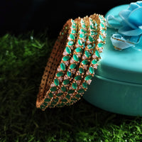 B061_Gorgeous Gold plated bangles studded with  American Diamond stones.