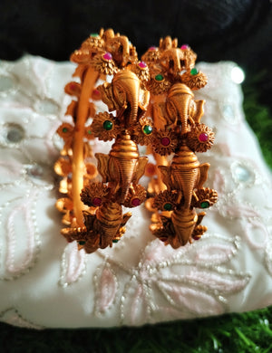 B0253_Gorgeous Ganesha design bangles with delicate work with a touch of green & pink ruby stones.