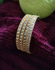B0258_Gorgeous golden bangles embellished with a touch of American diamond stones.