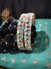 B0263_Lovely Rose Gold bangles embellished with American Diamond stones with a touch of dazzling ocean green stones.