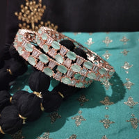 B0263_Lovely Rose Gold bangles embellished with American Diamond stones with a touch of dazzling ocean green stones.