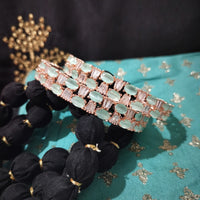B0263_Lovely Rose Gold bangles embellished with American Diamond stones with a touch of dazzling ocean green stones.