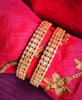 B0265_Gorgeous Gold plated bangles studded with  American Diamond  stones with delicate stone work.