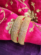 B0270_Classy broad Gold plated bangles studded with  delicate American Diamond  stones.