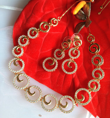 N0411_Elegant circular golden necklace embellished with american diamond stones.