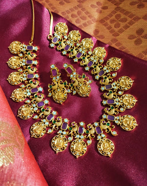 N0555_Traditional temple jewelry style Lakshmi design gold plated necklace set embellished with ruby stones .