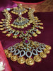 N0553_Grand temple jewelry style Lakshmi design gold plated necklace set embellished with ruby stones .