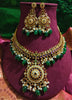 N0551_Grand designer gold plated necklace set embellished with ruby stones with green  bead drops.