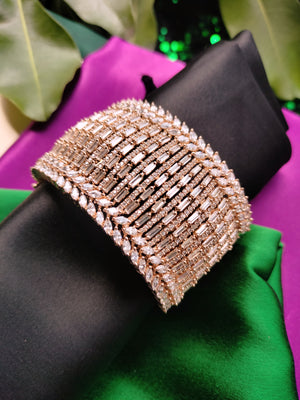 B0317_Grand Designer bracelets studded with delicate work of american diamond stones.