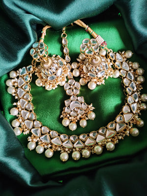 N0585_Royal Bridal style choker necklace set studded with Kundan stones with a touch of glossy pearls.