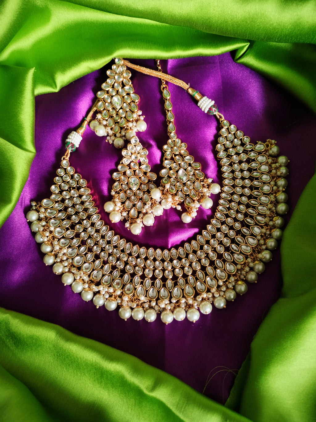 N0588_Royal Bridal style Elaborated choker necklace set studded with Kundan stones with a touch of glossy pearls.