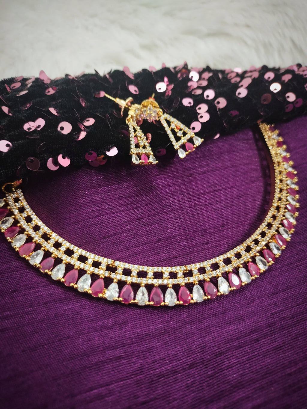 N01188_Grand Lovely designer Gold polished Necklace Set  embellished with American diamond stones with delicate Dark Pink Stones .