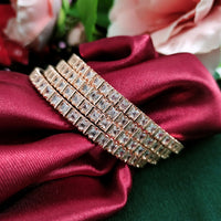 B02002_Gorgeous design rose gold polished 4 Bangles with delicate white stones work and beautiful patterns