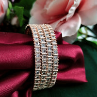 B02002_Gorgeous design rose gold polished 4 Bangles with delicate white stones work and beautiful patterns