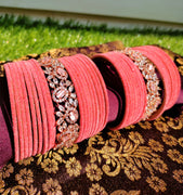 B02005_Elegant flowery design Bangles studded with American Diamond stones with a touch of baby pink stones with delicate stone work. Also 2 Dozens of pink velvet bangles