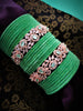 B02004_Elegant flowery design Bangles studded with American Diamond stones with a touch of mint green stones with delicate stone work. Also 2 Dozens of mint green velvet bangles