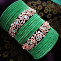 B02004_Elegant flowery design Bangles studded with American Diamond stones with a touch of mint green stones with delicate stone work. Also 2 Dozens of mint green velvet bangles