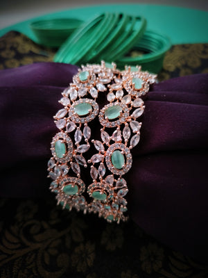 B0280_Elegant flowery design Bangles studded with American Diamond stones with a touch of mint green stones with delicate stone work.