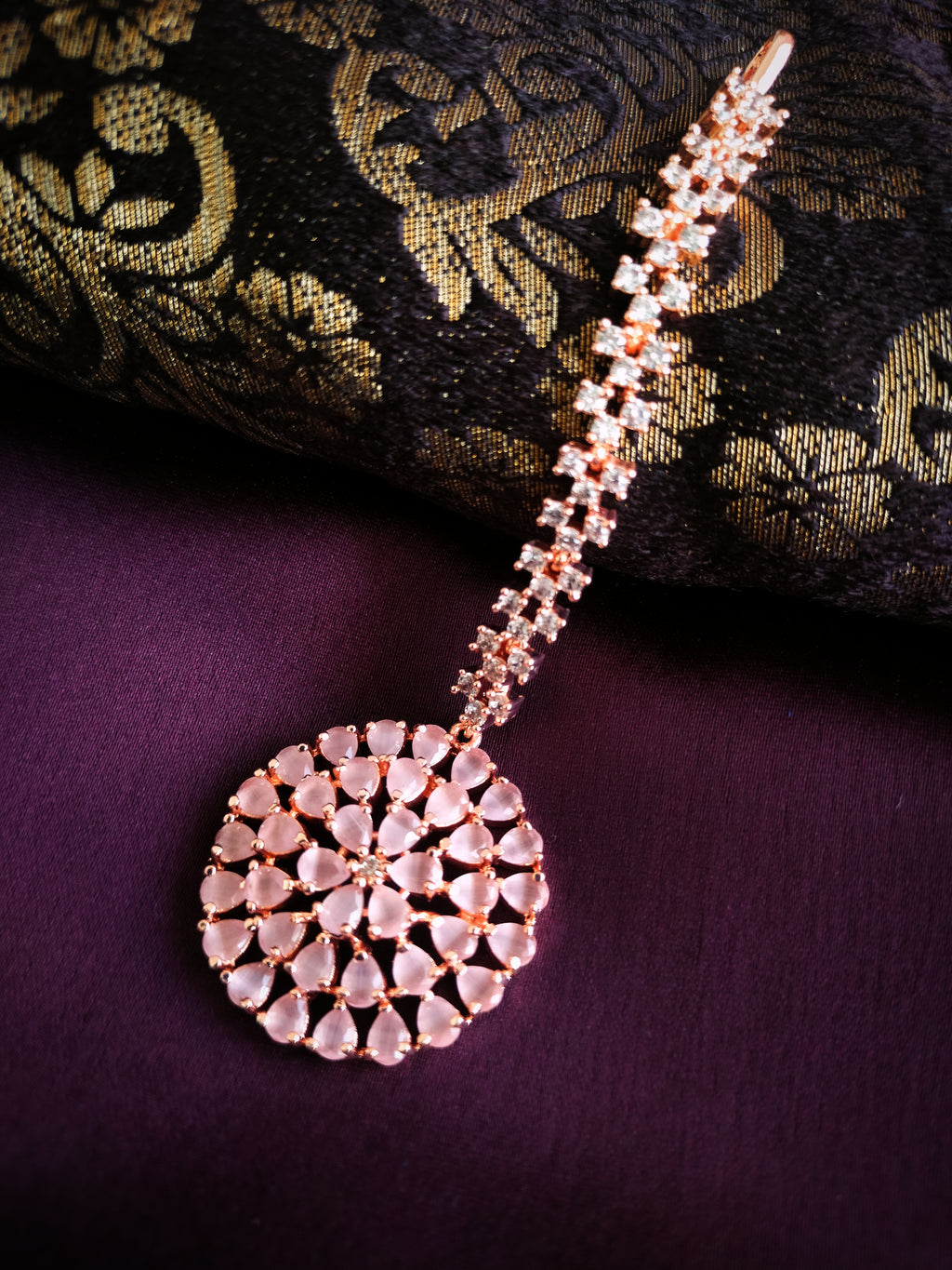 M044_Lovely designer  American diamond studded rose gold polished Maang tika with a touch of pink stones.