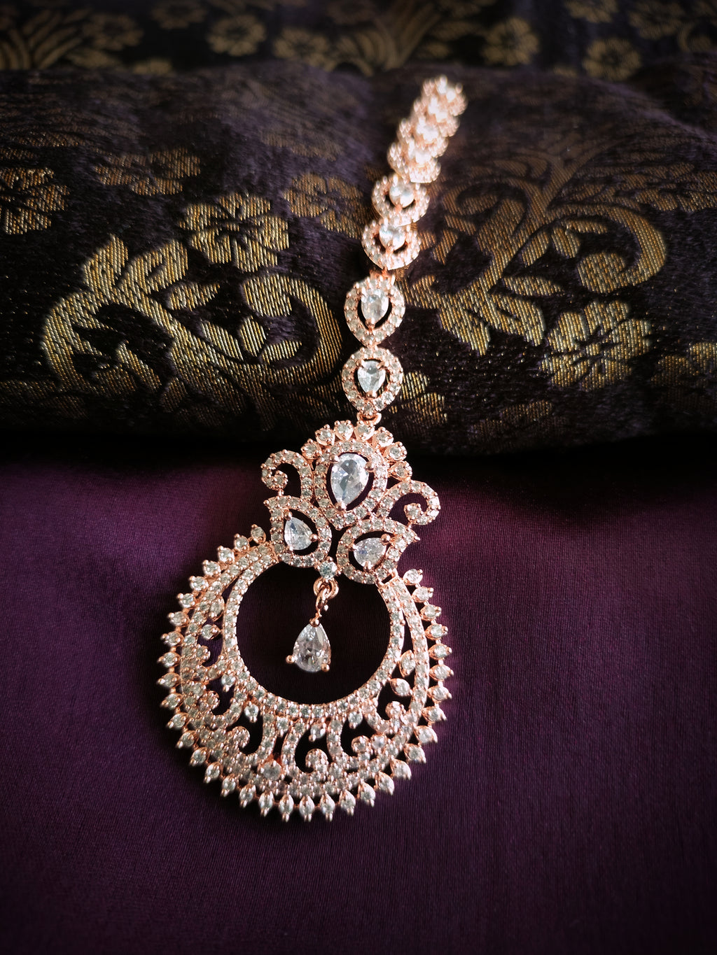 M047_Lovely designer  American diamond studded rose gold polished Maang tika with a touch of white stones.