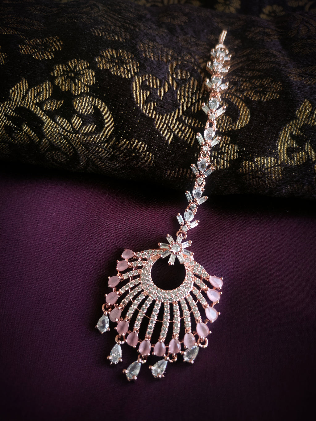 M049_Lovely designer  American diamond studded rose gold polished Maang tika with a touch of pink stones.