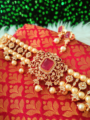 N03041_ classic matte gold polished temple jewelry choker style crafted design gold plated necklace set embellished with ruby and green stones .