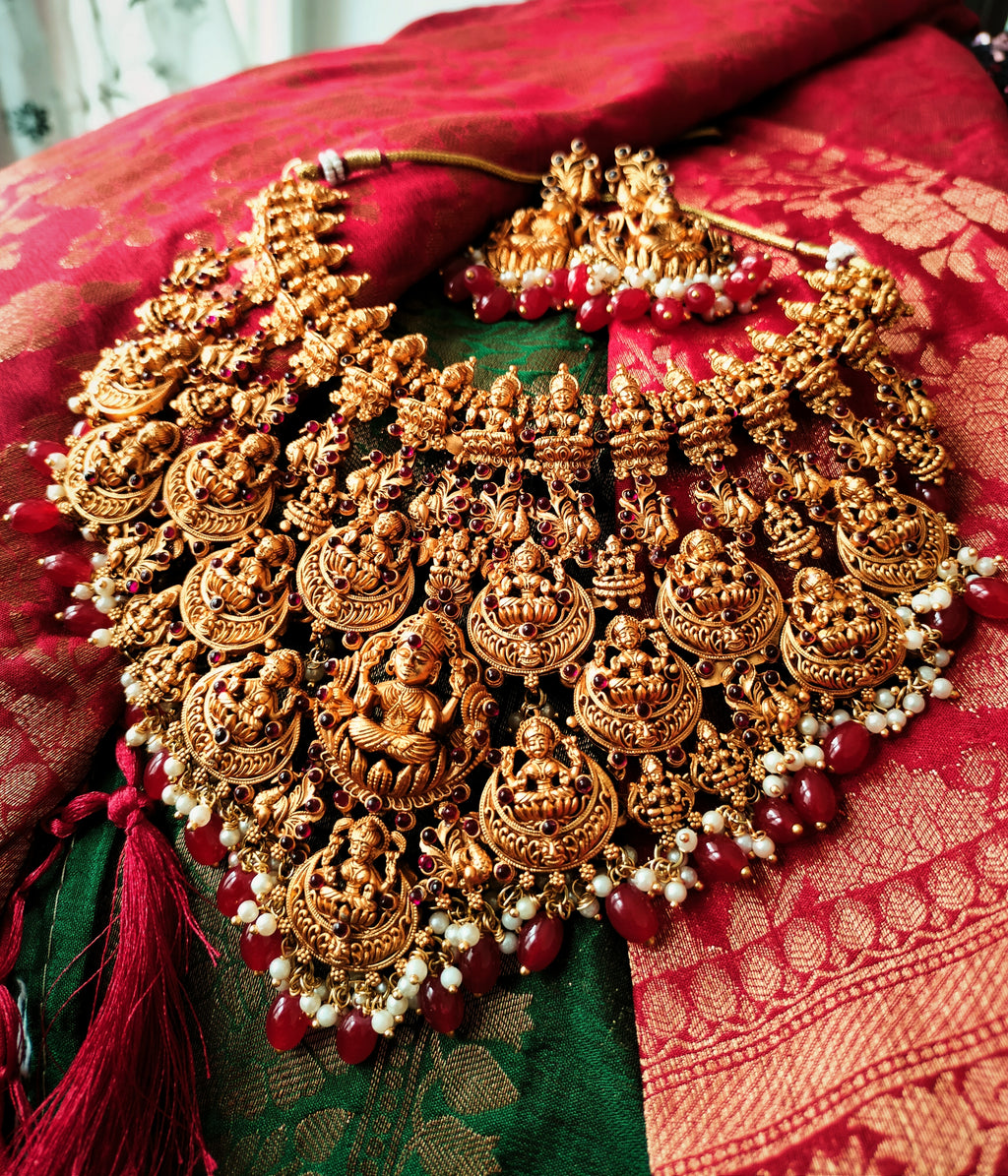 N03083_Grand Choker classic matte gold polished temple jewelry style crafted design gold plated necklace set embellished with red stones .