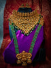 N03081_ Grand classic matte gold polished temple jewelry Long Haram & grand choker crafted design gold plated necklace set embellished with green stones .