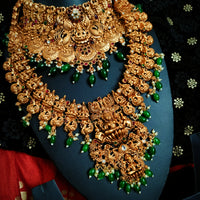 N03068_ Grand classic matte gold polished temple jewelry choker style and Long Haram crafted design gold plated necklace set embellished with ruby and green stones .