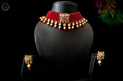 N071_Classy Style crimson red color Crystal Choker Necklace with delicate Kundan work embellished with pearls.